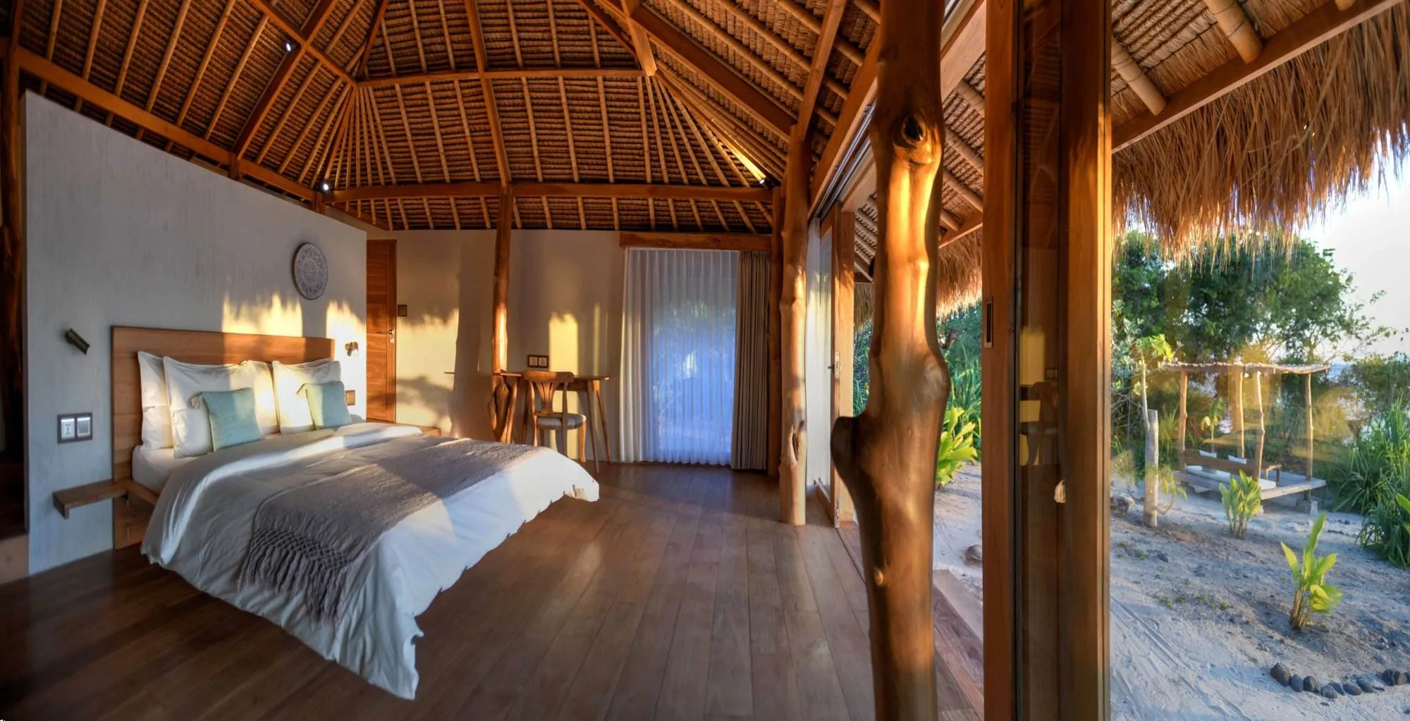 Accommodation with a beach cottage charm and an ocean view from the bedroom.